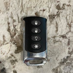 Interlogix TX-E101 Wireless 4-Button Chrome Keyfob; used but can reprogram.